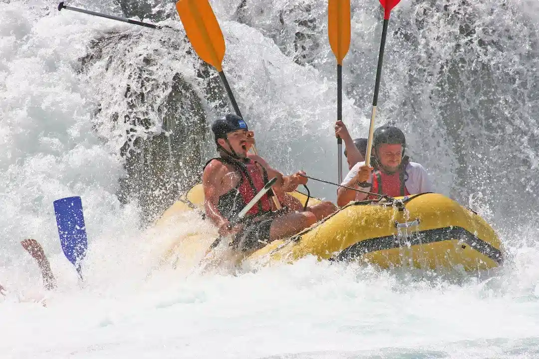 Rafting group running whitewater rapids in Utah